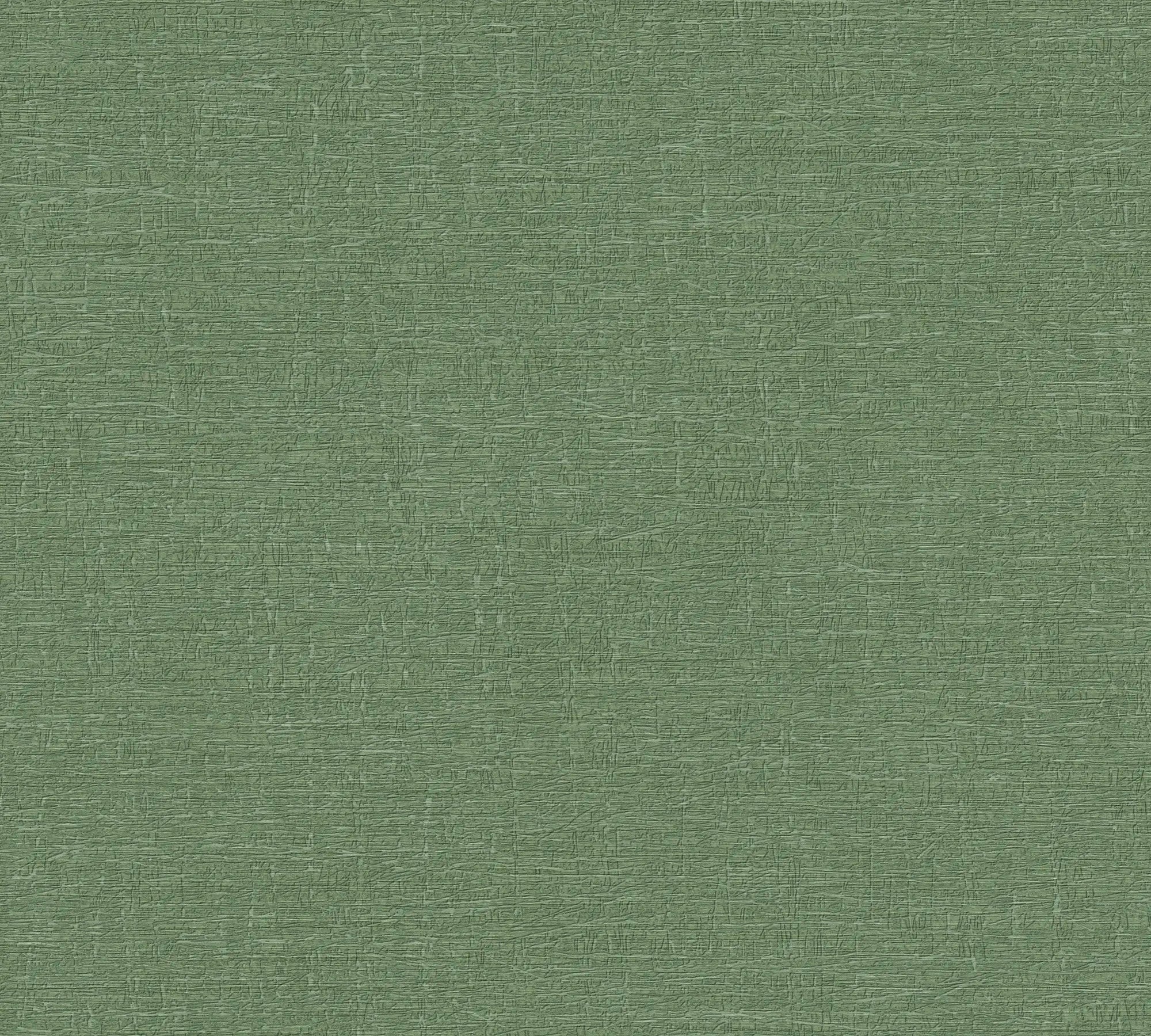 Nærbillede af Alma Textured - Emerald tapet, der viser den detaljerede teksturerede overflade i smaragdgrøn farve.