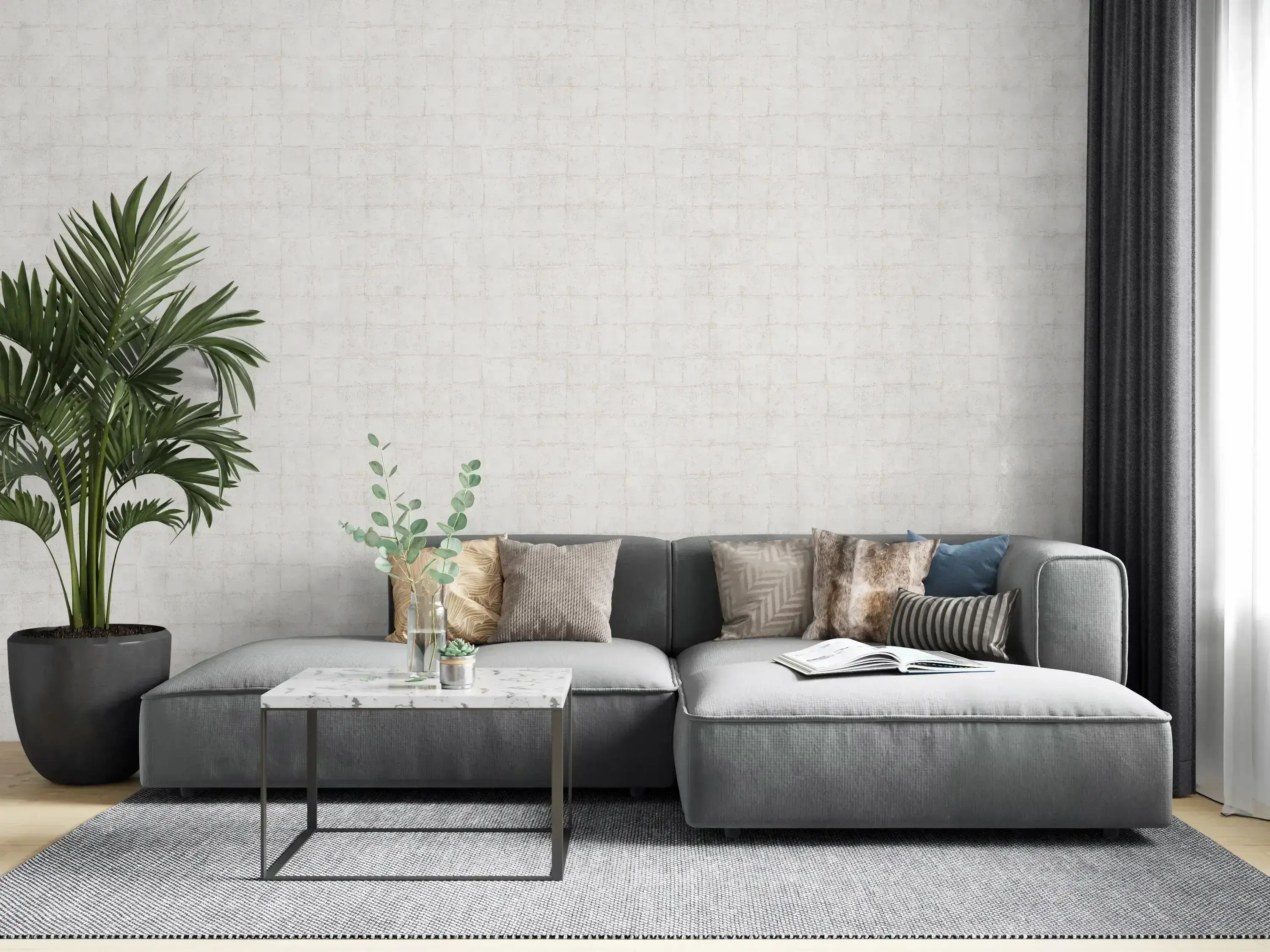 Botanic Grid - Mist tapet brugt i en moderne stue. Tapetet danner en subtil baggrund til en grå sofa og dekorative puder, med en plante til venstre.