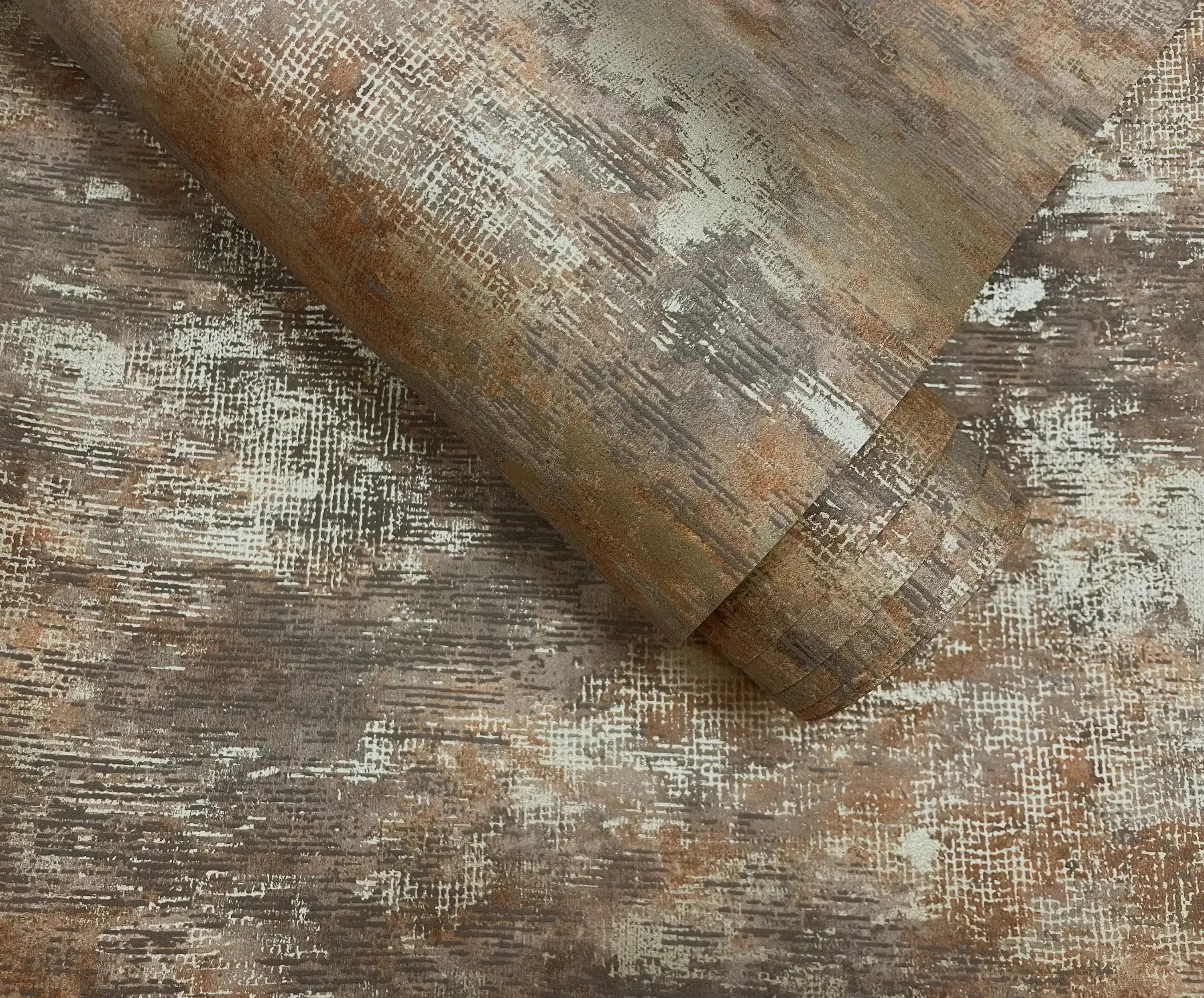 Rulle af Ozbek - Burnt tapet viser teksturer og farver tæt på, klar til at blive installeret.