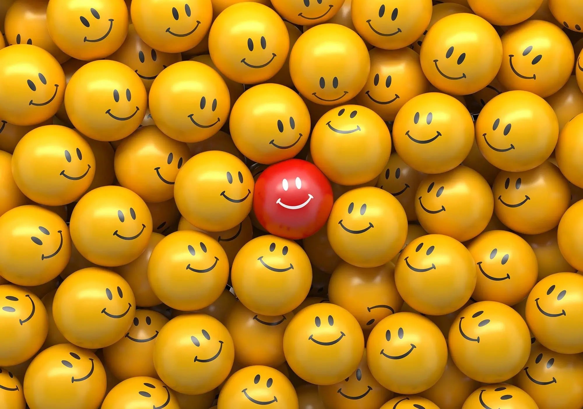 Billede 1 af Fototapet - Rød bold med smil blandt gule bolde med smil